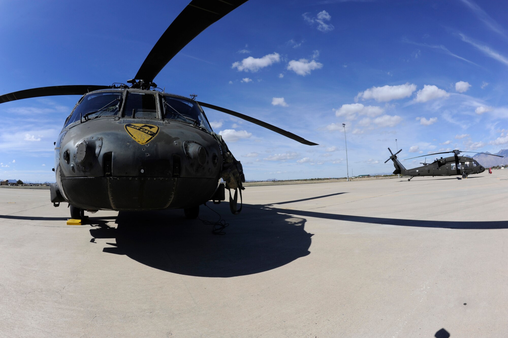 A U.S. Army UH-60 Black Hawk from Fort Hood, Texas awaits fuel at Davis-Monthan Air Force Base, Ariz., Feb. 7, 2014. The aircraft, assigned to the 3-227th Assault Helicopter Battalion, 1st Air Calvary Brigade, 1st Cavalry Division, travelled through D-M on their way to training in California. (U.S. Air Force photo by Airman 1st Class Betty R. Chevalier/released)