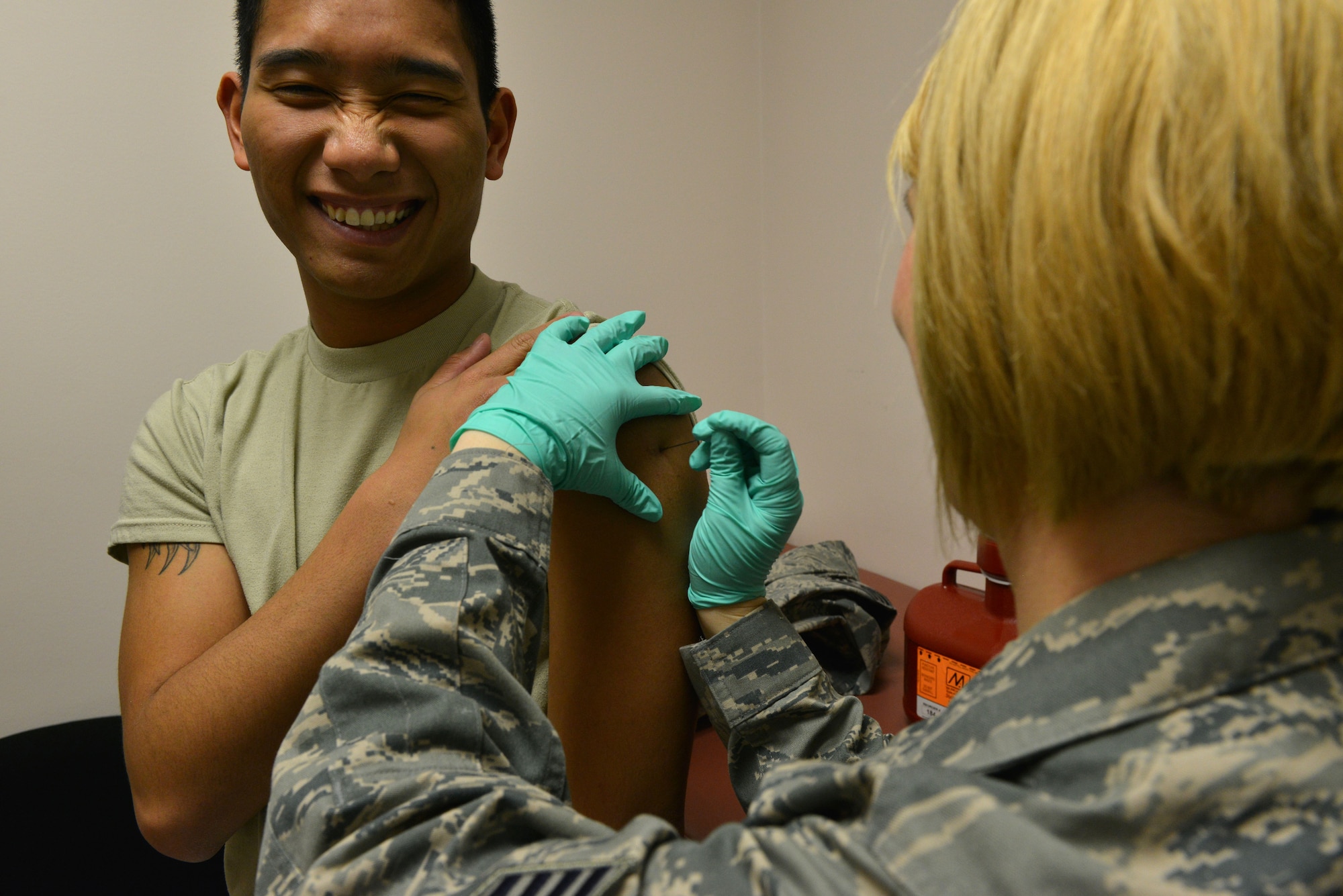 U.S. Air Force Senior Airman Josiah McDonald, 20th Logistic Readiness Squadron personal property counselor, receives the smallpox vaccination at Shaw Air Force Base, S.C., Feb. 5, 2014.  McDonald received the vaccination due to an up-coming deployment where the smallpox vaccination is mandatory. (U.S. Air Force photo by Airman 1st Class Jensen Stidham/Released)