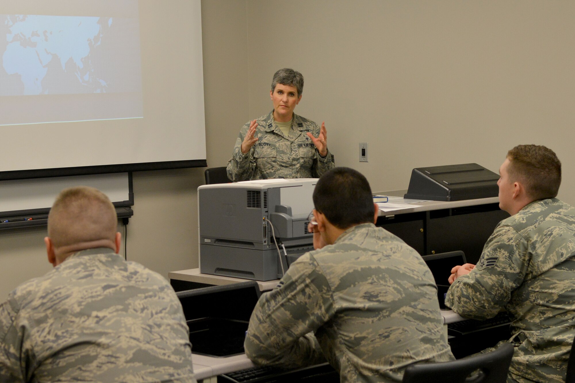 U.S. Air Force Chaplain (Capt.) Kathy Scott, 20th Fighter Wing chaplain, speaks to a room full of individuals during a comprehensive Airman fitness class, Shaw Air Force Base, S.C., Feb. 7, 2014. During the week Airmen were required to participate in at least two briefings that caught their interest. (U.S. Air Force photo by Senior Airman Ashley L. Gardner/Released)