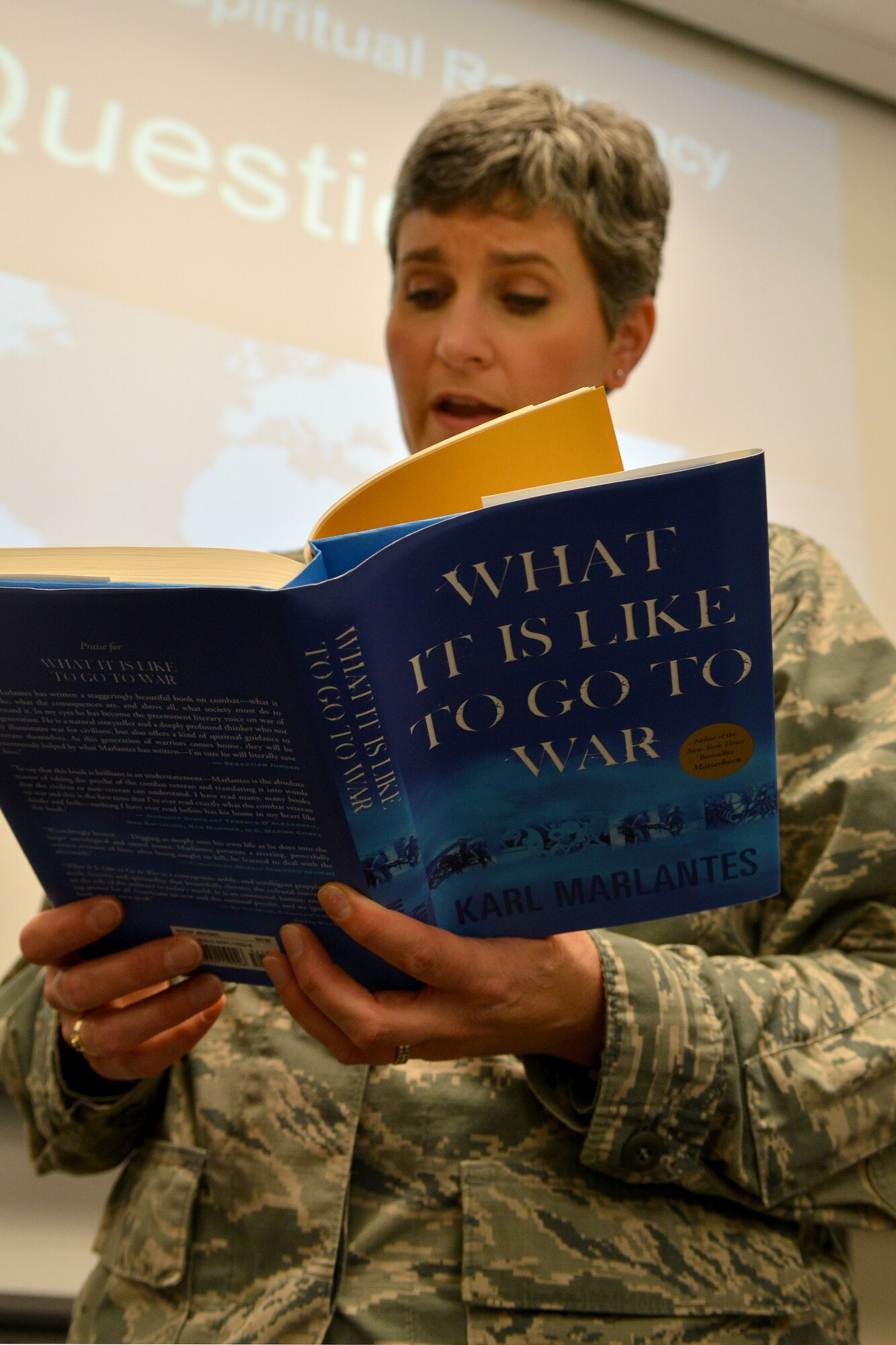 U.S. Air Force Chaplain (Capt.) Kathy Scott, 20th Fighter Wing chaplain, reads “What It Is Like To Go To War” during a comprehensive Airman fitness class, Shaw Air Force Base, S.C., Feb. 7, 2014. CAF week is built off of the four pillars which are mental, social, spiritual and mental. (U.S. Air Force photo by Senior Airman Ashley L. Gardner/Released)