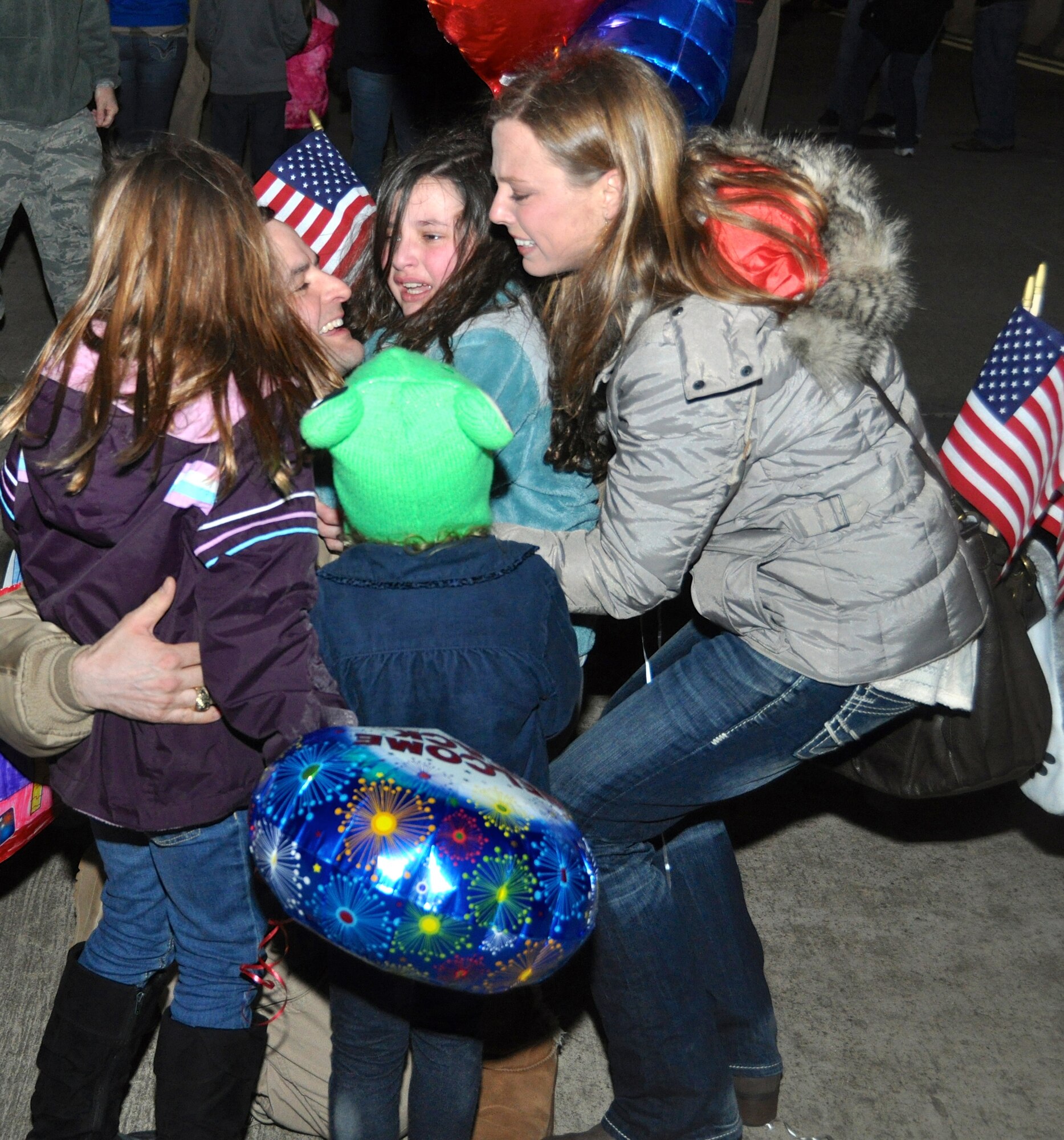 Reservists from the 301st Fighter Wing returned to chilly temperatures and a warm welcome home. Family members and friends displayed signs anticipating their loved-one's arrival from Afghanistan where they were deployed in support of Operation Enduring Freedom. (U.S. Air Force photo/MSgt Josh Woods)