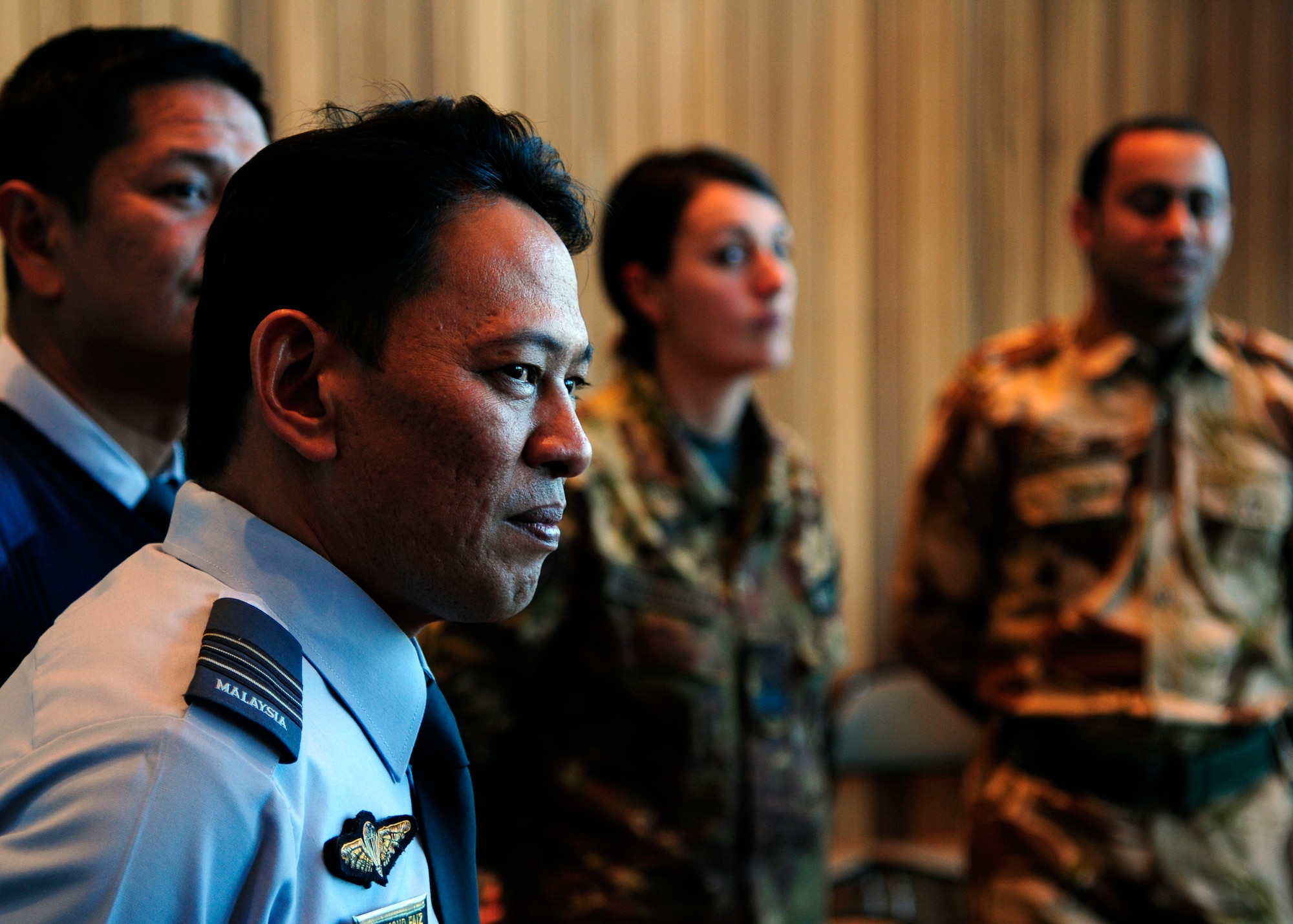 SAN ANGELO, Texas – Royal Malaysian air force Maj. Mohd Faiz Abdul Jalil, International Military Student Officer, listens to Rep. Mike Conaway, 11th District of Texas, during a meet and greet at the San Angelo Visitor Center Jan. 21. The students were given the chance to share their experiences with Conaway and listen to Conaway’s thoughts on the intelligence community. (U.S. Air Force photo/ Airman 1st Class Devin Boyer)