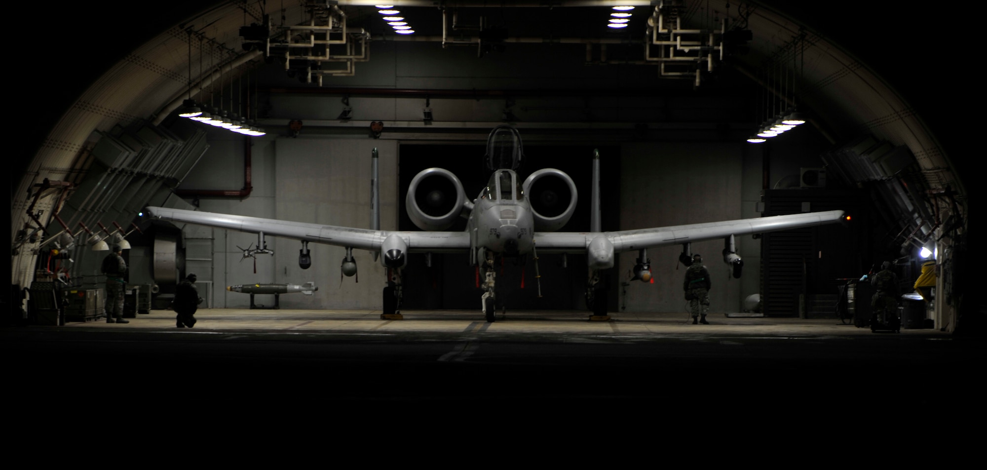 An A-10 Thunderbolt II sits in a hangar prior to launching for the first sortie of Beverly Midnight 14-02 at Osan Air Base, Republic of Korea, Feb. 10, 2014. Exercises like BM 14-02 test Airmen on their ability to operate and accomplish the mission during war-time contingency operations. (U.S. Air Force photo/Senior Airman Siuta B. Ika)