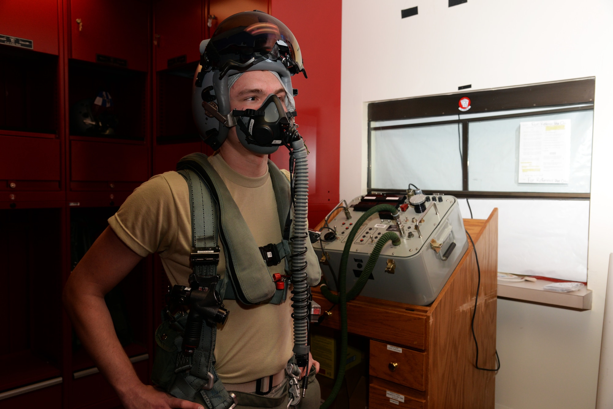 U.S. Air Force Airman 1st Class Kevin Maples, 20th Operations Support Squadron aircrew flight equipment apprentice assigned to the 77th Fighter Squadron poses for a photo during a pressure check on a CSU-13B/P anti G-suit, Feb. 5, 2014, Shaw Air Force Base, S.C. Aircrew flight equipment Airmen maintain all the life support and saving equipment that pilots depend on in case of an emergency. (U.S. Air Force photo by Airman 1st Class Jonathan Bass/Released)