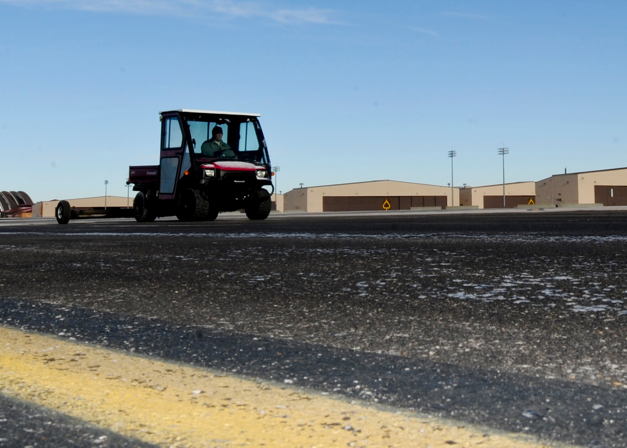 Master Sgt. Lance Stephenson, 28th Bomb Wing Foreign Object Debris program manager, drives the FOD Mule across the flight line at Ellsworth Air Force Base, S.D., Jan. 31, 2014. Stephenson conducts daily FOD checks on the flightline to ensure a safe work environment and prevent damage to aircraft and equipment. (U.S. Air Force photo by Senior Airman Anania Tekurio/Released)