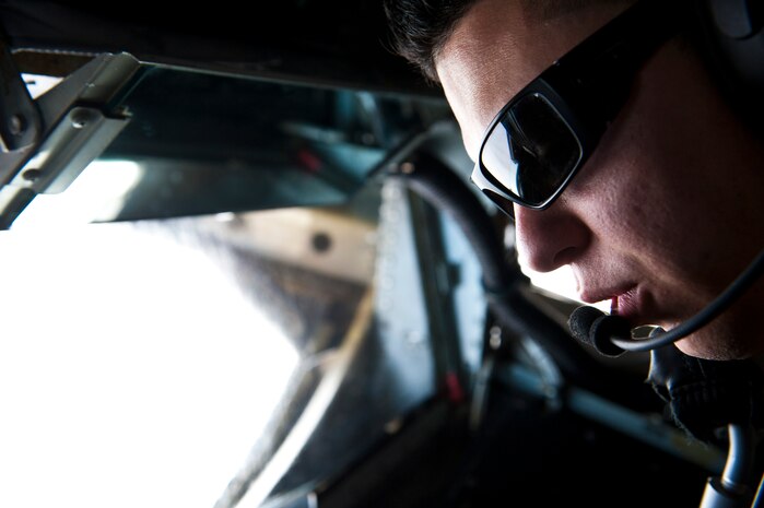 U.S. Air Force Senior Airman Joshua Ortega, 92nd Air Refueling Squadron boom operator, prepares a mid-air re-fuel during Red Flag 14-1 over the Nevada Test and Training Range Feb. 4, 2014. Mid-air re-fueling is vital to a combat mission because it allows fighters, bombers, and other aircraft essential to the fight to refuel without having to waste valuable time refueling on the ground. The more these re-fueling operations are practiced in a controlled environment the smoother they will run in a real-world combat environment. Red Flag is hosted at Nellis AFB, Nev., and provides realistic combat training in a contested, degraded and operationally limited environment. (U.S. Air Force photo by Airman 1st Class Thomas Spangler)