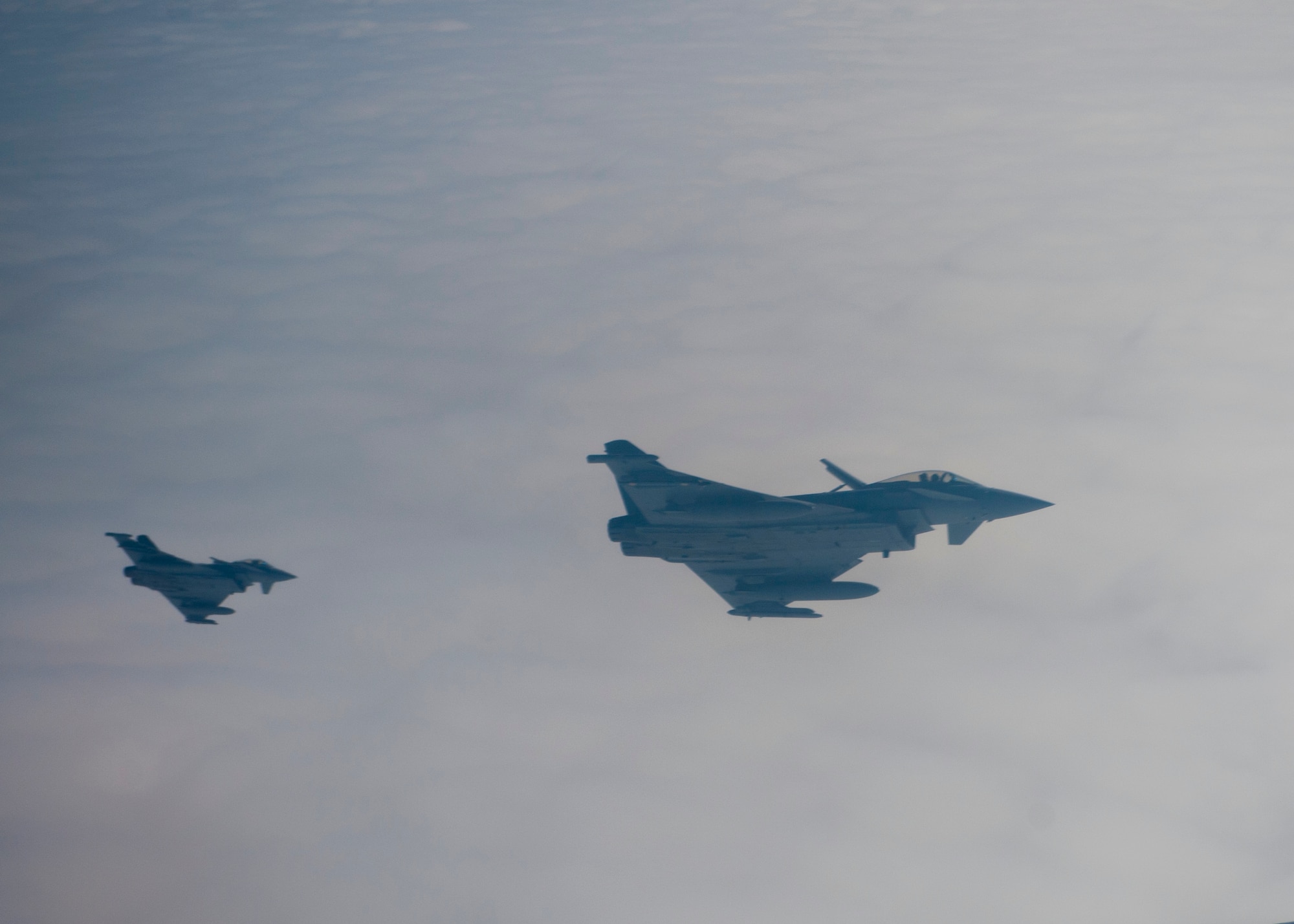 Two Royal Air Force Typhoons assigned to No. 6 Squadron from Royal Air Force Leachare, United Kingdom, fly over the Nevada Test and Training Range during Red Flag 14-1 Feb. 6 2014. Red Flag 14-1 is hosted at Nellis Air Force Base, Nev., and involves the air power of the U.S. Air Force, Navy, Marine Corps, the Royal Australian Air Force, and the RAF. More than 30 countries have participated directly in a Red Flag exercise.. (U.S. Air Force photo by Airman 1st Class Thomas Spangler)