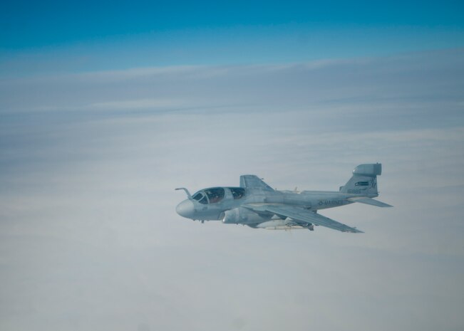A U.S. Marine Corps EA-6B Prowler assigned to 2nd Marine Air Wing from Marine Corps Air Station Cherry Point, N.C., flies over the Nevada Test and Training Range during Red Flag 14-1 Feb. 6, 2014. The EA-6B Prowler is an electronic warfare aircraft that jams enemy radar systems. Red Flag is a combat training exercise hosted at Nellis Air Force Base, Nev., that incorporates all spectrums of warfare including command and control, real-time intelligence, analysis and exploitation, and electronic warfare. (U.S. Air Force photo by Airman 1st Class Thomas Spangler)