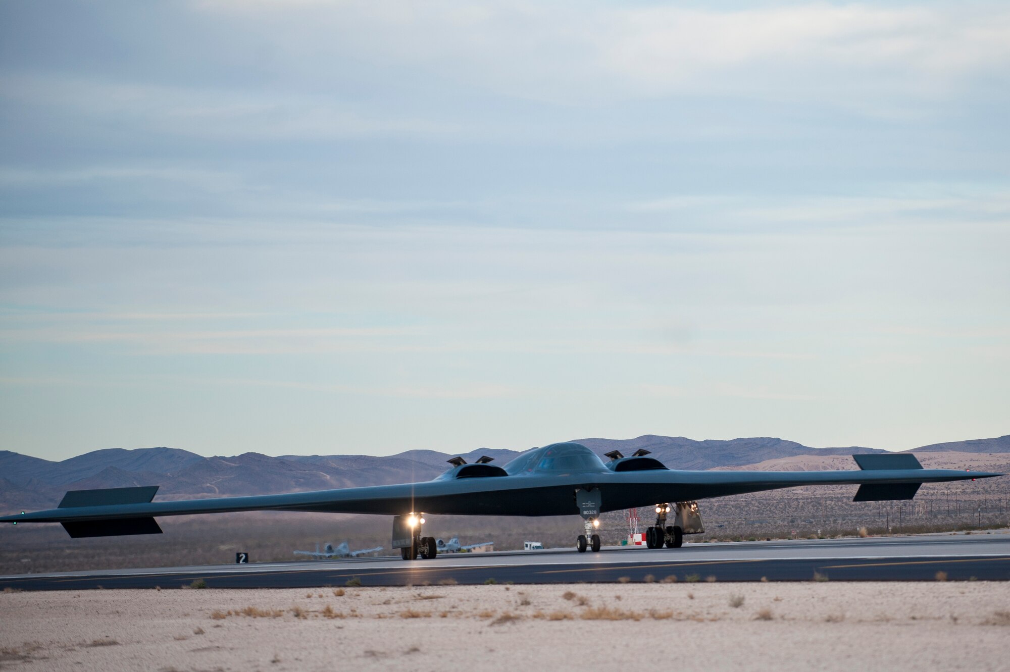 A B-2 Spirit from the 13th Bomb Squadron, Whiteman Air Force Base, Mo., touches down for landing after completing a Red Flag 14-1 training mission Feb. 4, 2014, at Nellis Air Force Base, Nev. The B-2 Spirit is a multi-role bomber capable of delivering both conventional and nuclear munitions, and deploys to Nellis in support of “blue force” operations. During Red Flag training missions, the B-2 Spirit aircrews practice infiltrating contested enemy airspace and destroying high value targets.  (U.S. Air Force photo by Airman 1st Class Joshua Kleinholz)