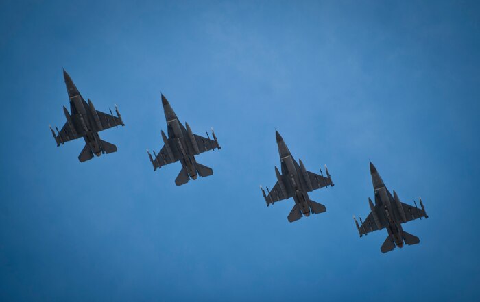 F-16 Fighting Falcons from the 140th Fighter Squadron, Buckley Air Force Base, Col., soar over Nellis Air Force Base, Nev., prior to landing at the end of a Red Flag 14-1 training mission Feb. 4, 2014. Aircraft and service members deploy to Nellis AFB for Red Flag under the Air Expeditionary Force concept and make up the exercise's "blue" forces.” By working together, these blue forces are able to use the diverse capabilities of their assets execute missions, such as air interdiction, combat search and rescue, close air support, dynamic targeting and defensive counter air. (U.S. Air Force photo by Airman 1st Class Joshua Kleinholz)