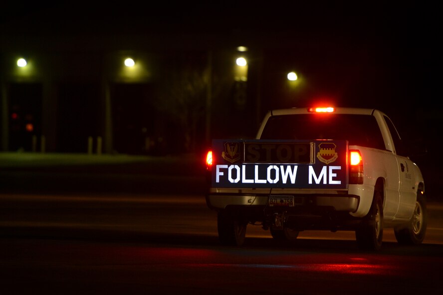 An aircraft marshal truck gets in position to guide an inbound aircraft containing approximately 200 Team Shaw Airmen returning from deployment, Feb. 7, 2014, Shaw Air Force Base, S.C. The Airmen returned home from U.S. Central Command’s Area of Responsibility after completing a five month tour. (U.S. Air Force photo by Staff Sgt. Kenny Holston / Released)