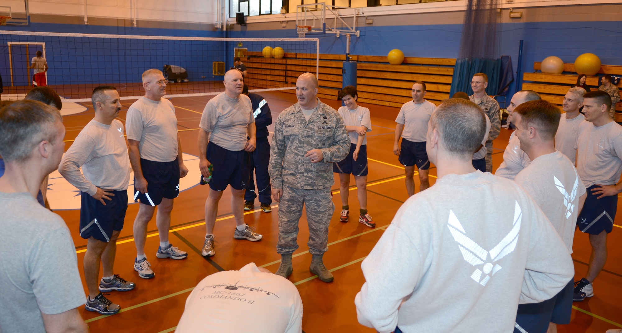 U.S. Air Force Chief Master Sgt. William Markham, center, 352nd Special Operations Group command chief, speaks to Team Mildenhall chief master sergeants and colonels Feb. 7, 2014, following the “Chiefs vs. Eagles” game at the Northside Fitness Center sports day on RAF Mildenhall, England. Markham delivered a speech to the players after the game and then presented a “Chiefs vs. Eagles” themed trophy to the “Chiefs.” The “Chiefs” came out on top after winning two games in a row and cementing their victory over the “Eagles” in the grand finale of the sports day. (U.S. Air Force photo by Airman 1st Class Dillon Johnston/Released)