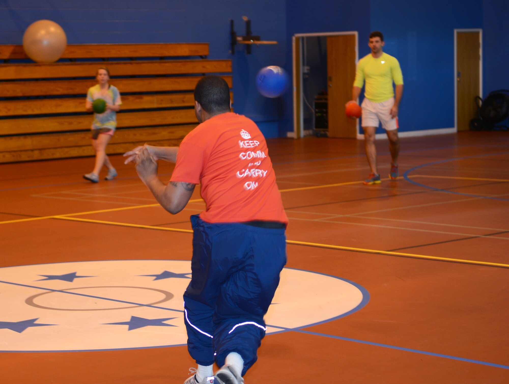 U.S. Air Force Senior Airman Travis Vernon, 100th Communications Squadron knowledge operator from Santa Monica, Calif., throws a ball at the opposing dodgeball team Feb. 7, 2014, during the Northside Fitness Center sports day on RAF Mildenhall, England. Vernon’s team, Team ACE, representing Airmen Committed to Excellence, won the dodgeball tournament by beating two other teams over six games. The day included multiple events which promoted fitness and camaraderie. (U.S. Air Force photo by Airman 1st Class Dillon Johnston/Released)