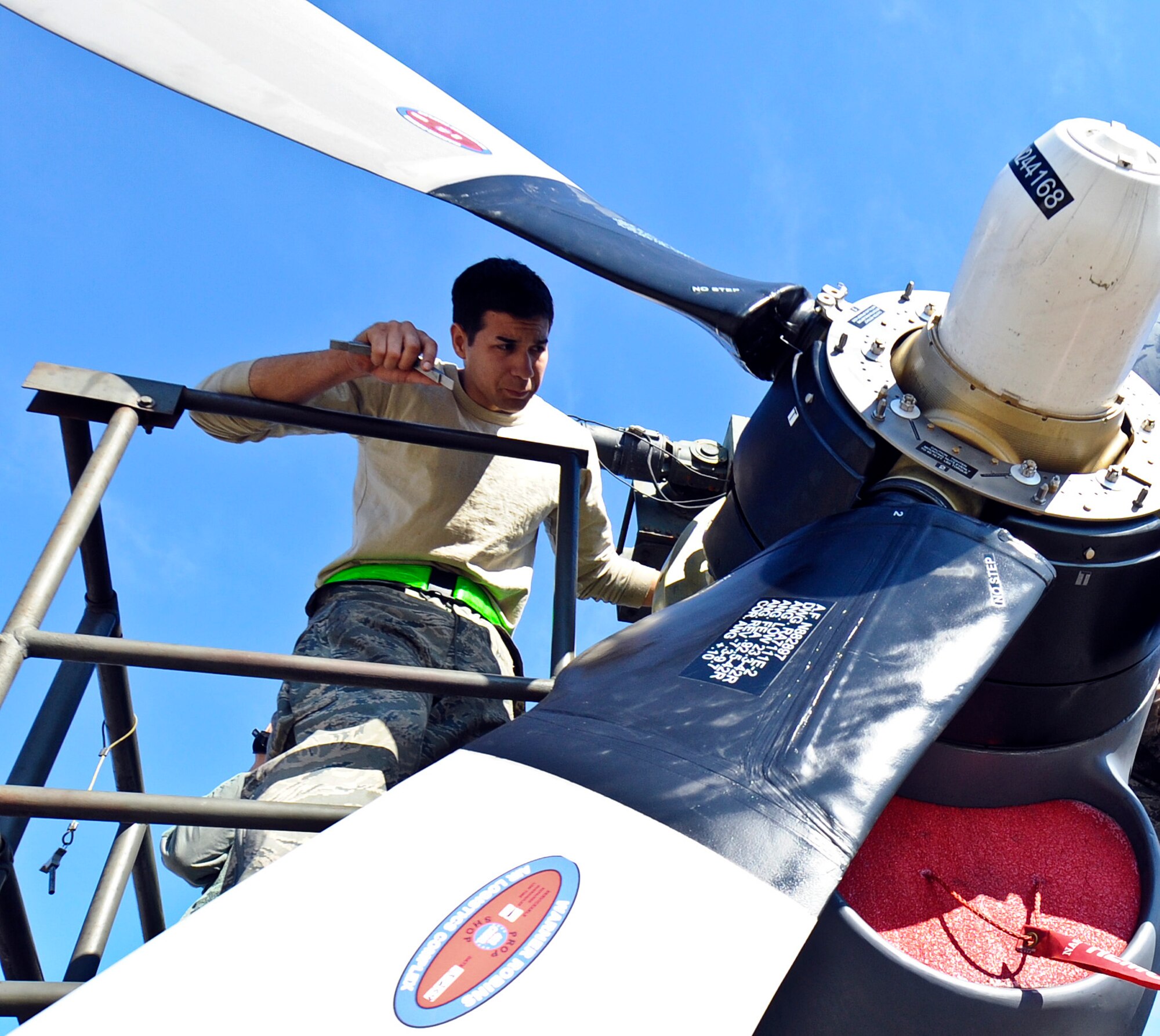 Airman 1st Class Miykael Santini, 1st Special Operations Component Maintenance Squadron aerospace propulsion journeyman, checks his work after replacing an engine part at the engine test cell on Hurlburt Field, Fla., Feb. 7, 2014. Once the Airmen repaired the engine, they ran it to check for fluid leaks. (U.S. Air Force photo/Senior Airman Michelle Vickers)  