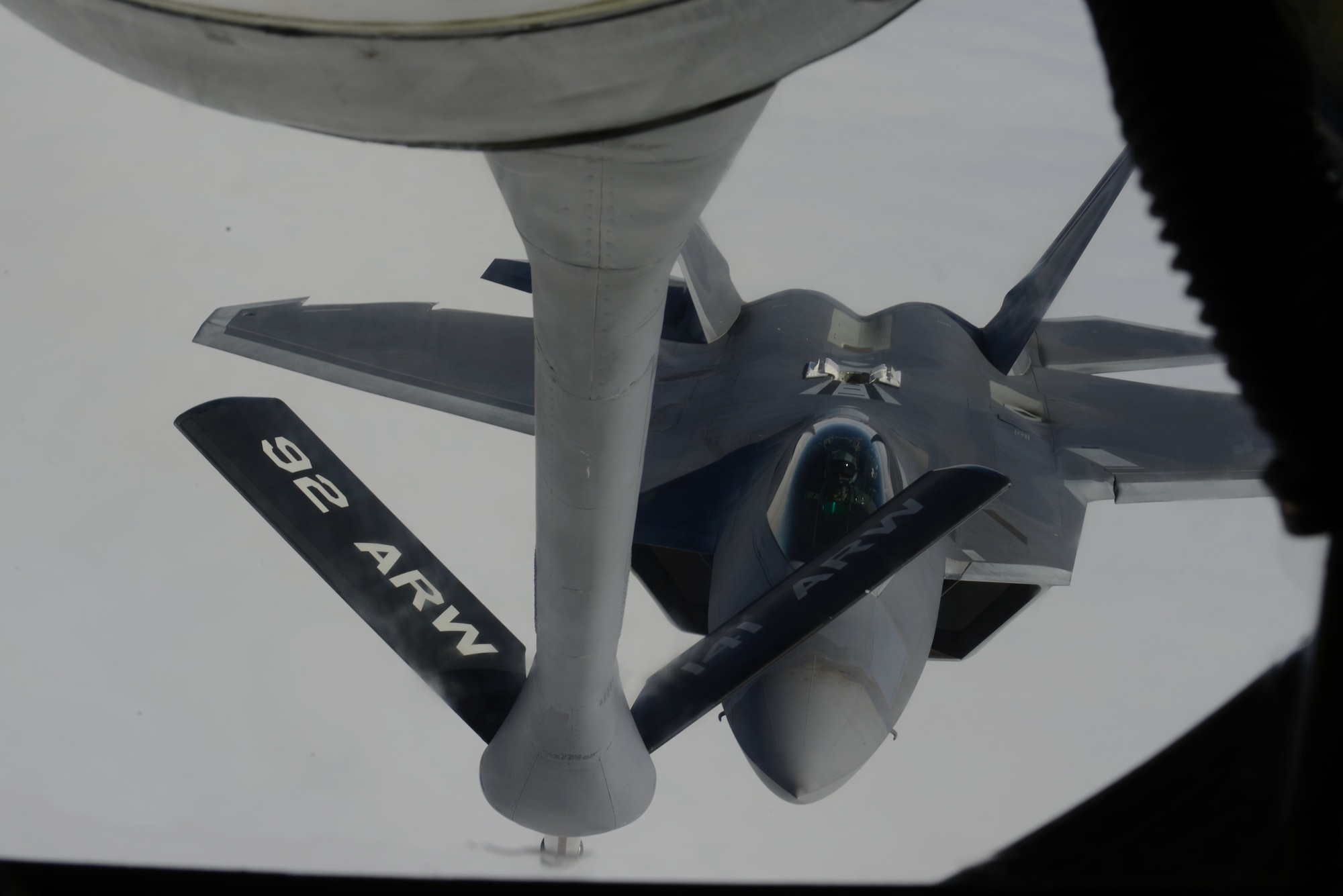 An F-22 Raptor from the 1st Fighter Wing, Joint Base Langley-Eustis, Va., prepares to refuel from a KC-135 Stratotanker from the 93rd Air Refueling Squadron from Fairchild Air Force Base, Wash., during Red Flag 14-1 at Nellis AFB, Nev., Feb. 6, 2014. Flying units from around the Department of Defense deploy to Nellis AFB to participate in Red Flag exercises that are typically held three times a year and organized by the 414th Combat Training Squadron. (U.S. Air Force photo by Senior Airman Benjamin Sutton/Released) 