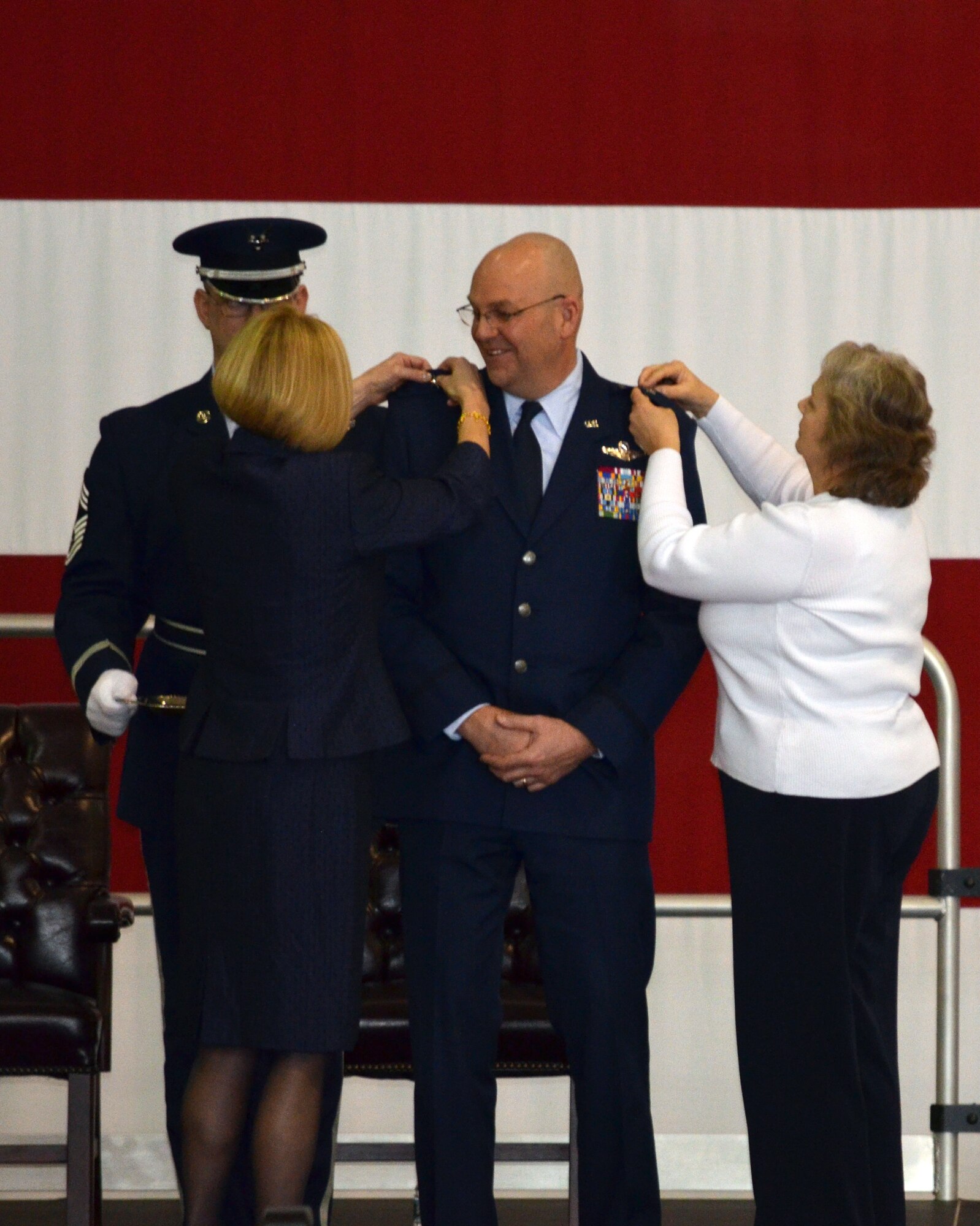 Family members pin on Brig. Gen. Vautrain's new rank. (U.S. Air Force photo/SSgt. Kelly Goonan)