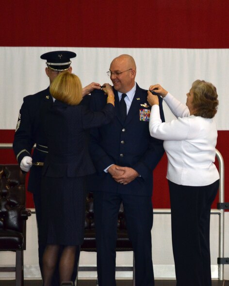 Family members pin on Brig. Gen. Vautrain's new rank. (U.S. Air Force photo/SSgt. Kelly Goonan)