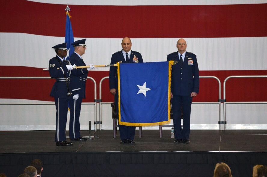 Maj. Gen. Richard "Beef" Haddad stands next to Brig. Gen. Steven Vautrain as the brigadier generals flag is unfurled during the pin-on ceremony for Brig. Gen. Vautrain, Saturday, Feb 8. (U.S. Air Force photo/SSgt. Kelly Goonan)