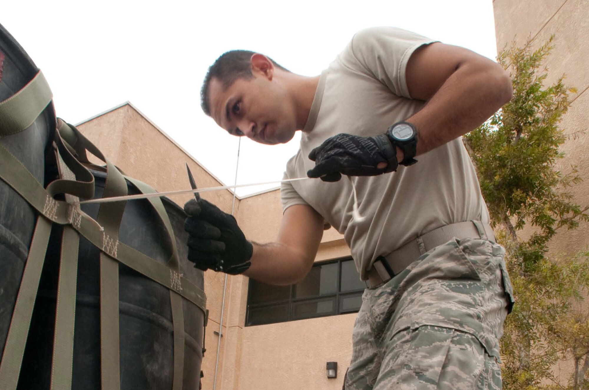 Staff Sgt. Puga prepares a pallet for C130 airdrop training Dec. 6, 2013 at Channel Islands Air National Guard Station, Port Hueneme, Calif. (U.S. Air Force photo: Senior Airman Nicholas Carzis) 