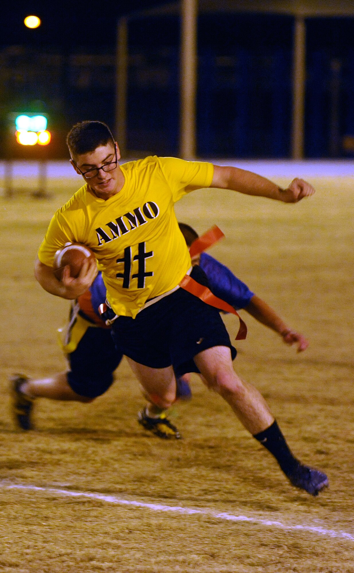 Alex Back, 56th Equipment Maintenance Squadron munitions line delivery crew member, successfully dodges a defender. (U.S. Air Force photo/Senior Airman Jason Colbert)