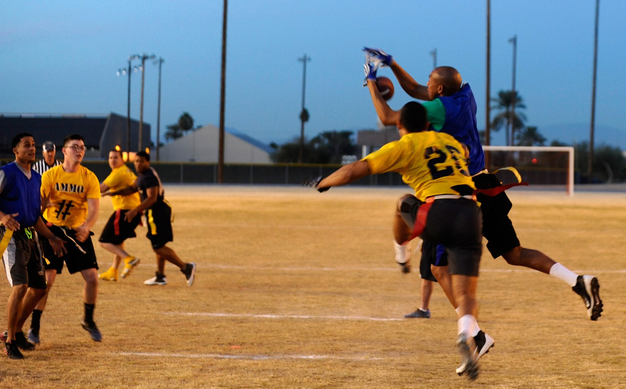 Chris Howard, 56th Operations Support Squadron air traffic controller, intercepts a pass Jan. 28 during a flag football game at Luke Air Force Base. The 56th Operations Group team faced off against the 56th Equipment Maintenance Squadron team, winning 8-6. (U.S. Air Force photo/Senior Airman Jason Colbert)