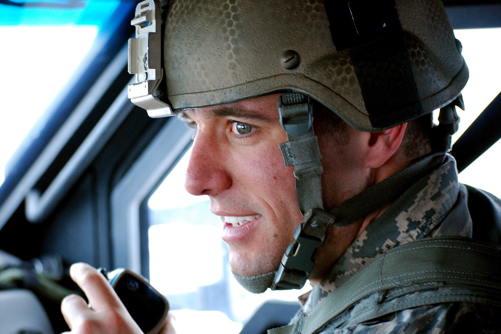 First Lt. Michael Allen, 741st Missile Security Forces Squadron convoy commander, coordinates the convoy's movements during a missile maintenance convoy mission Feb. 7, 2014. (U.S. Air Force photo by Tech. Sgt. Steve Grever/RELEASED)