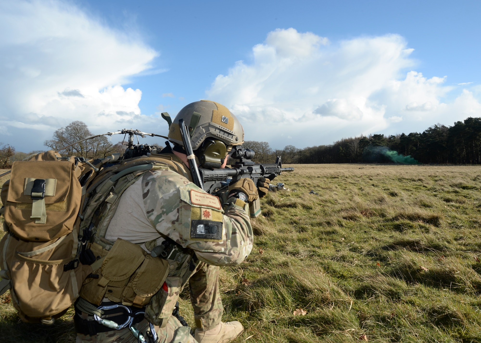 Maj. Patrick Gruber, 56th Rescue Squadron director of operations, sets up a perimeter defense at the Stanford Training Area, England, Feb. 6, 2014. Airmen participated in four days of training exercises in support of the Air Force’s combat search and rescue mission. (U.S. Air Force photo by Airman 1st Class Nigel Sandridge/Released)