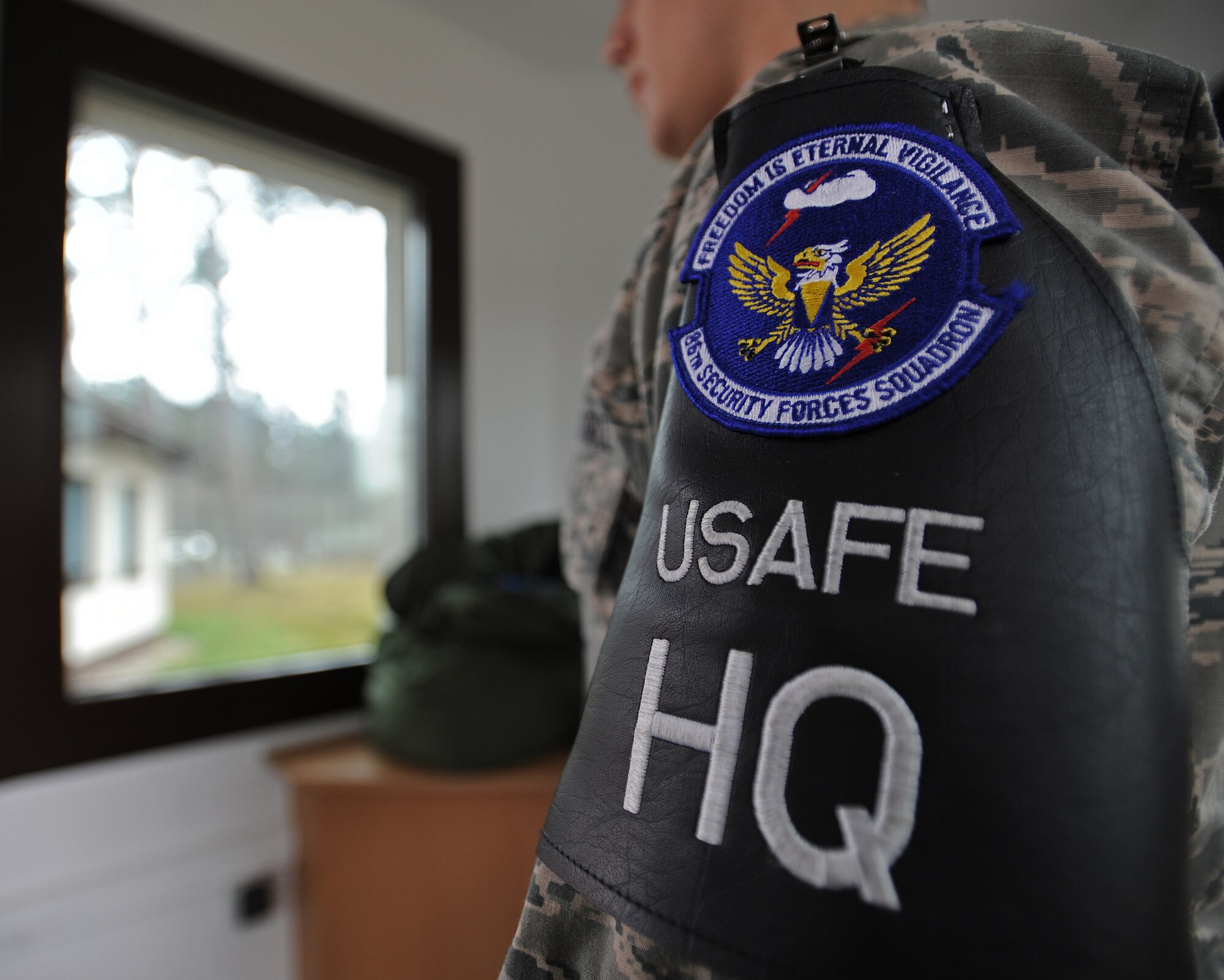 Airman 1st Class Christian Kampe, 86th Security Forces defender, starts his duty day by checking the log book at an entry way Feb. 5, 2014, Ramstein Air Base, Germany. Kampe is a first-term Airman who exceeds the expectations set by his leadership by going above and beyond on and off the job. (U.S. Air Force photo/Airman 1st Class Holly Mansfield)