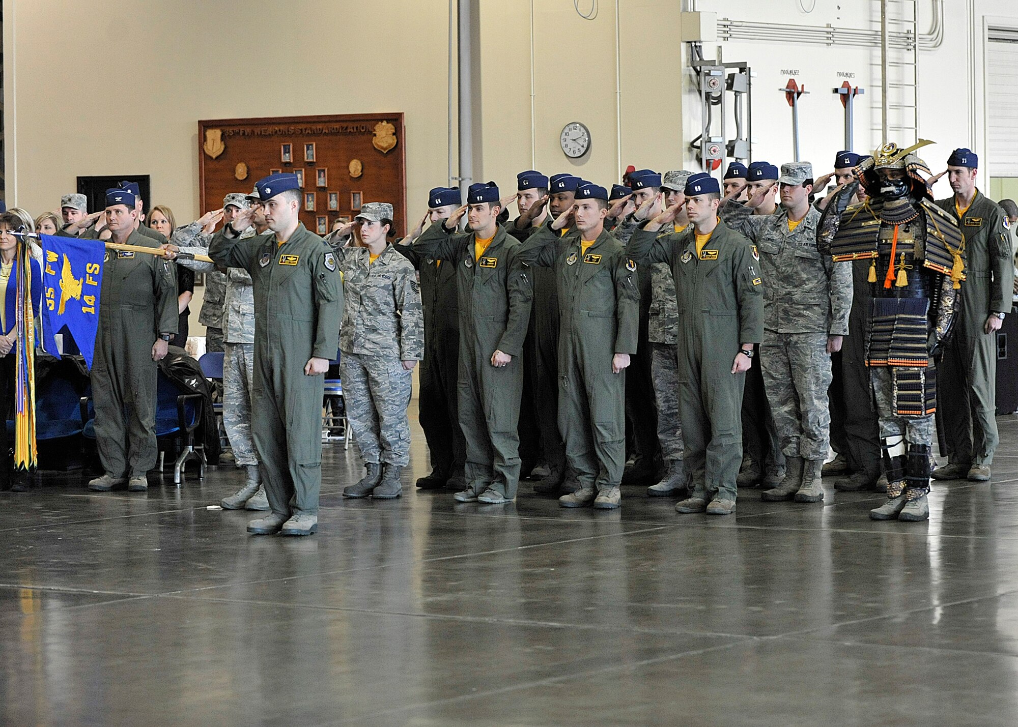 MISAWA AIR BASE, Japan -- Members of the 14th Fighter Squadron salute during a change of command ceremony at Misawa Air Base, Japan, Feb. 7, 2014. More than 100 U.S. Military, Japan Air Self Defense Force and family members were in attendance. (U.S. Air Force photo/Staff Sgt. Tong Duong.)
