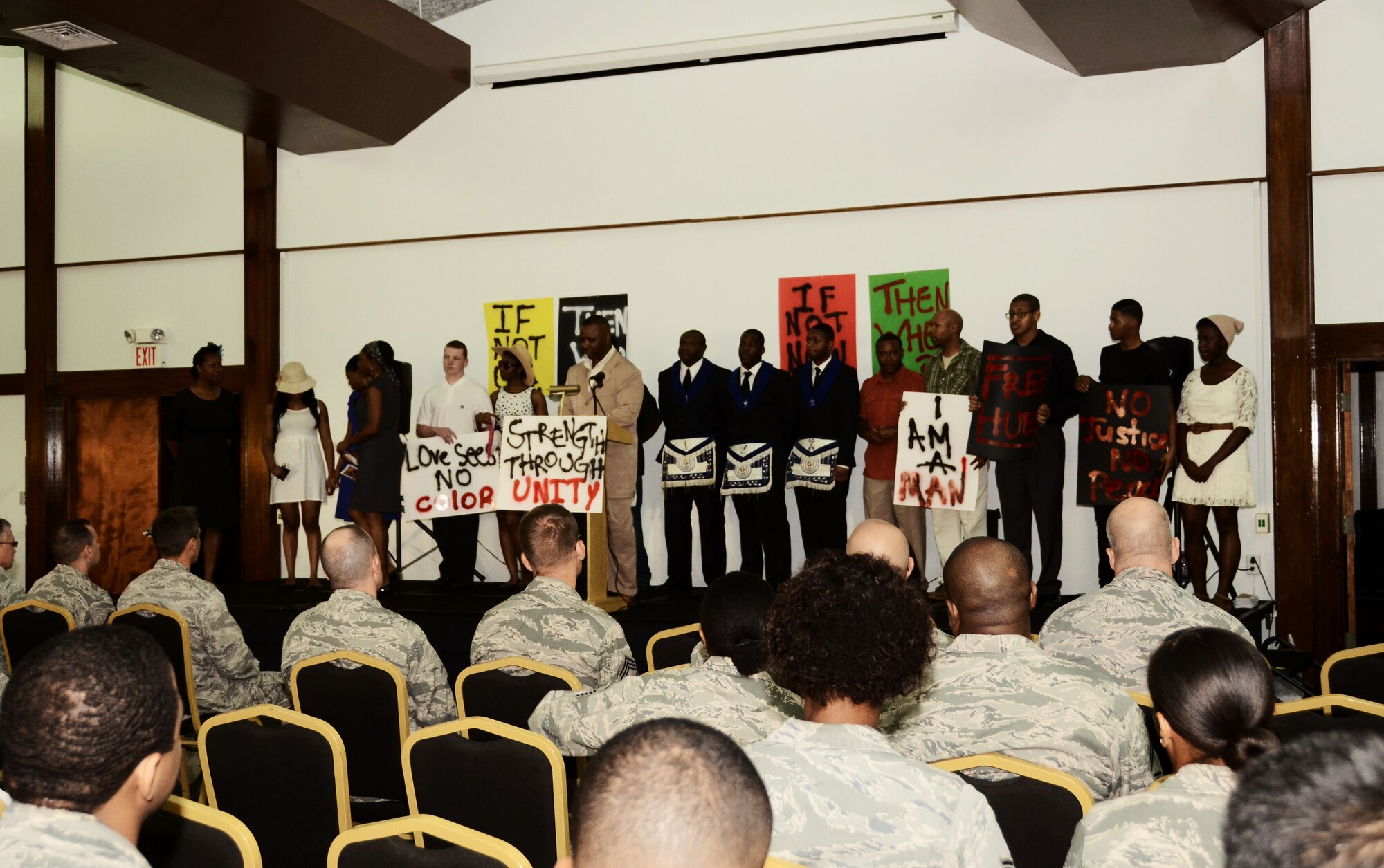 Performers take the stage during an observance event to honor Martin Luther King, Jr. Jan. 15, 2014, at the Sunrise Conference Center on Andersen Air Force Base, Guam. The event, hosted by the African American Heritage Association, was opened to all members of Team Andersen to show their appreciation for King’s legacy. (U.S. Air Force photo by Airman 1st Class Amanda Morris/Released) 