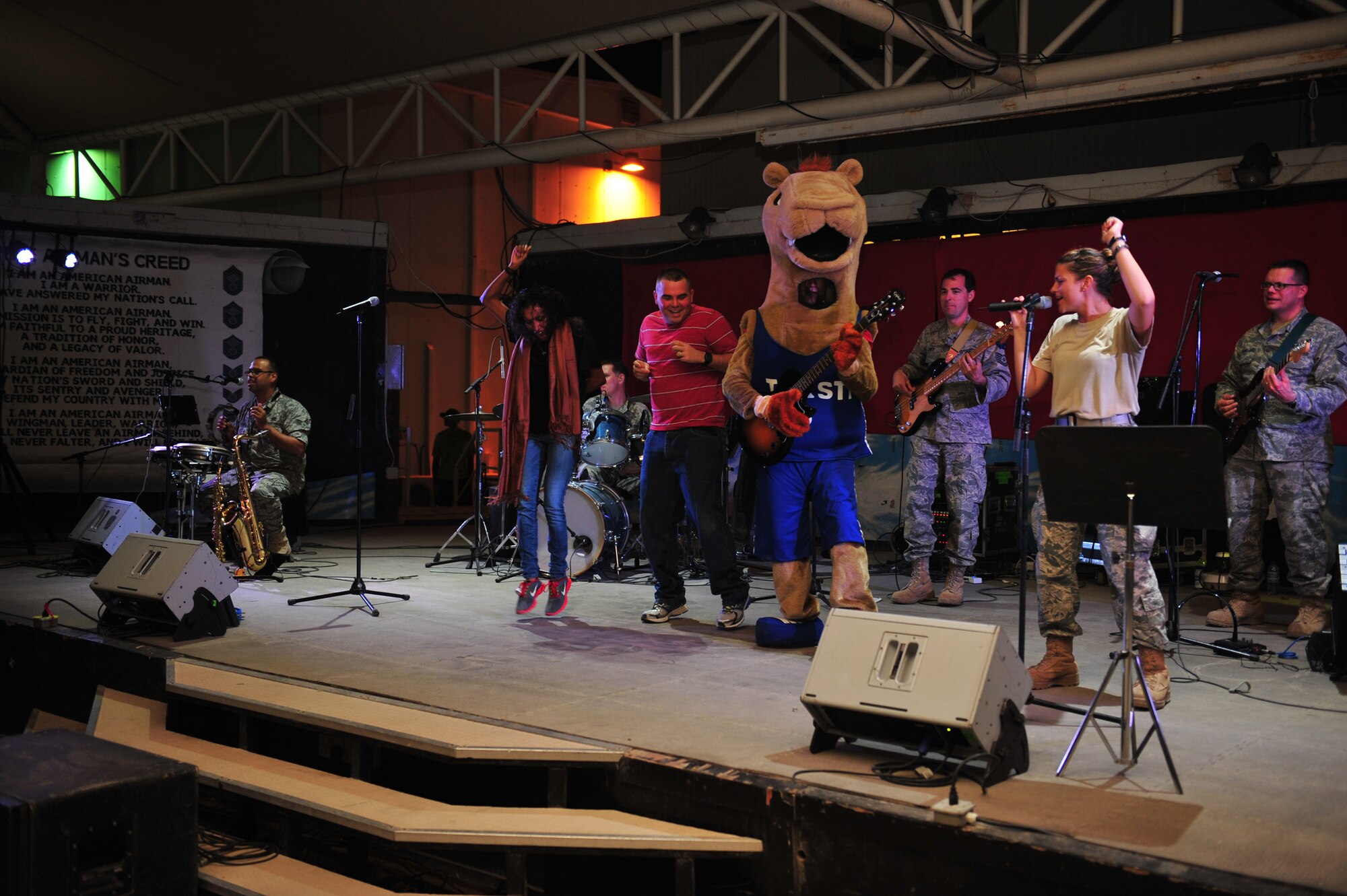 The U.S. Air Forces Central Command Band Systems Go performs at the pavilion for Airmen at the 380th Air Expeditionary Wing at an undisclosed location in Southwest Asia, Feb. 4, 2014.. (U.S. Air Force photo by Staff Sgt. Michael Means/Released)