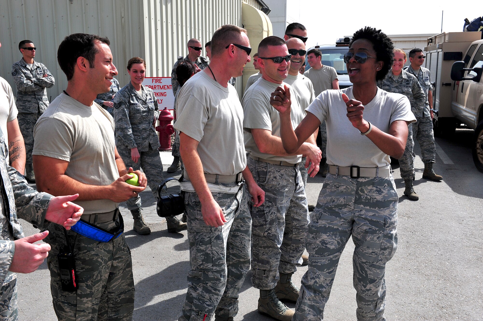 Air Force Tech. Sgt. Felita LaRock, U.S. Air Forces Central, Band vocalist, sings for members of the 380th Air Expeditionary Wing during a strolling tour here, Feb. 4, 2014. (U.S. Air Force photo by Staff Sgt. Michael Means/Released)