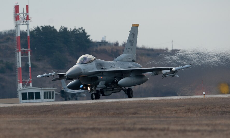 An 80th Fighter Squadron F-16 Fighting Falcon takes off for a sortie during Beverly Midnight 14-01 at Kunsan Air Base, Republic of Korea, Feb. 7, 2014. BM 14-01 tested the Wolf Pack’s ability to react to a surprise attack and continue launching aircraft. (U.S. Air Force photos by Senior Airman Armando A. Schwier-Morales/Released)