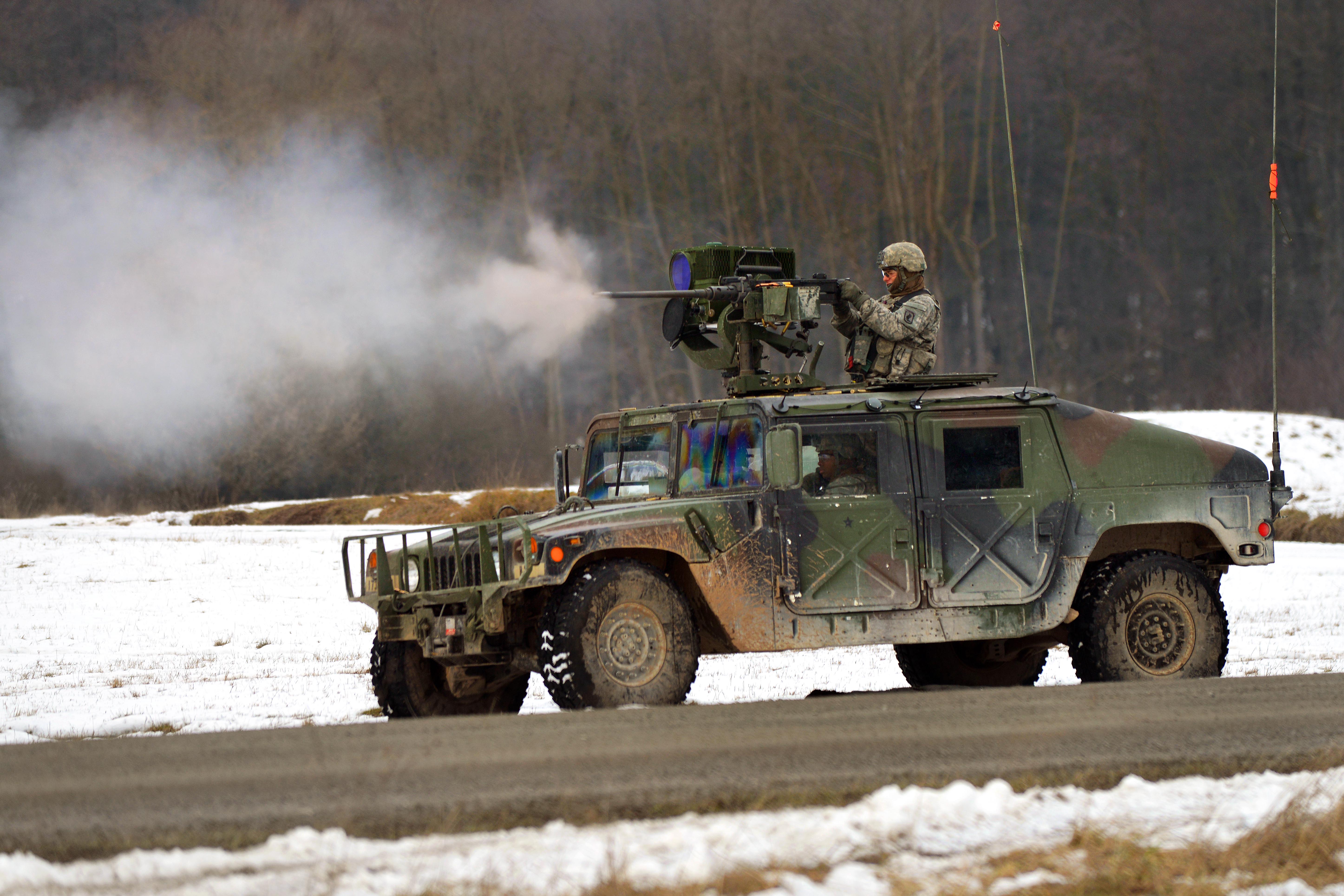 U S Army Spc Justin Barnett Fires A 50 Caliber Heavy Machine Gun During A Live Fire