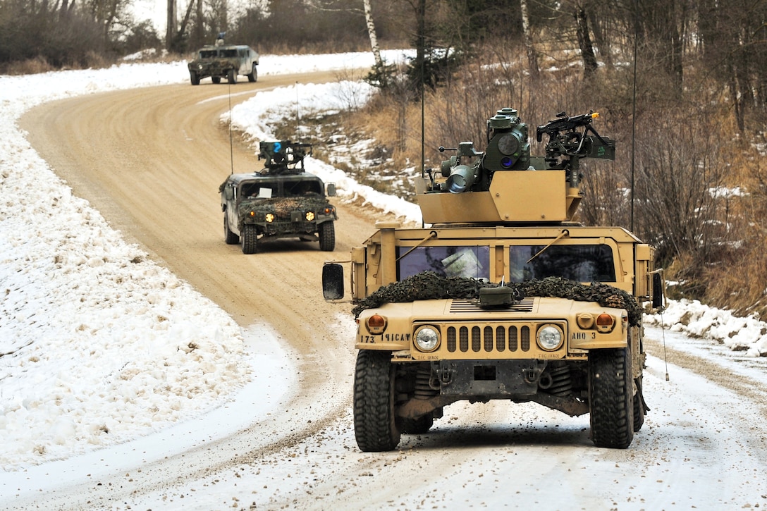 U.S. paratroopers travel in a convoy of Humvee vehicles during an exercise at the 7th Army Joint Multinational Training Command's Grafenwoehr Training Area, Germany, Feb. 6, 2014.