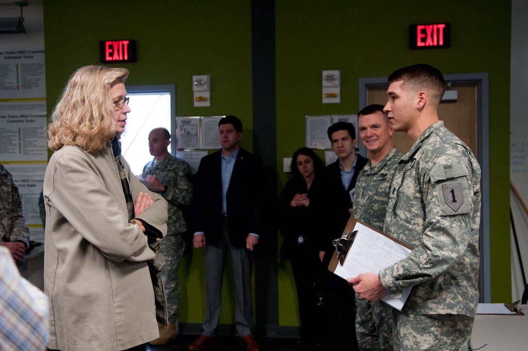 Acting Deputy Defense Secretary Christine H. Fox talks to soldiers during her visit to observe training on Fort Riley, Kan., Feb. 10, 2014.