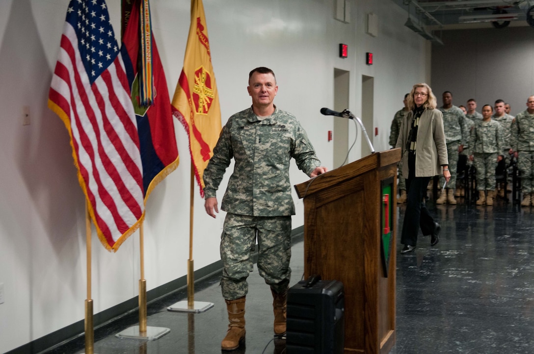 Army Maj. Gen. Paul E. Funk II, commanding general of the 1st Infantry Division and Fort Riley, Kan., prepares to introduce Acting Deputy Defense Secretary Christine H. Fox on the base, Feb. 10, 2014.