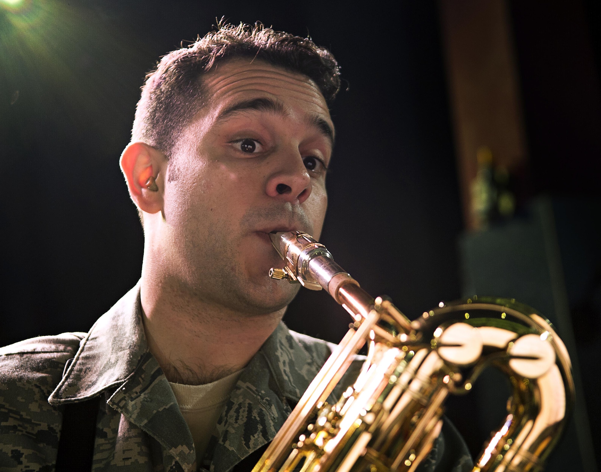 Staff Sgt. Lencys Esteban-Nunez plays saxophone during a rehearsal with The Ambassadors, the U.S. Air Forces in Europe Band jazz ensemble, Jan. 16, 2014, at Ramstein Air Base, Germany. Esteban-Nunez learned to play saxophone during his childhood in Republic of Cuba before immigrating to the United States and joining the Air Force. (U.S. Air Force photo/Tech. Sgt. Benjamin Wilson)