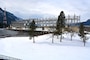 Shows winter snowfall at Bonneville Lock and Dam's First Powerhouse and spillway on Feb. 7, 2014.