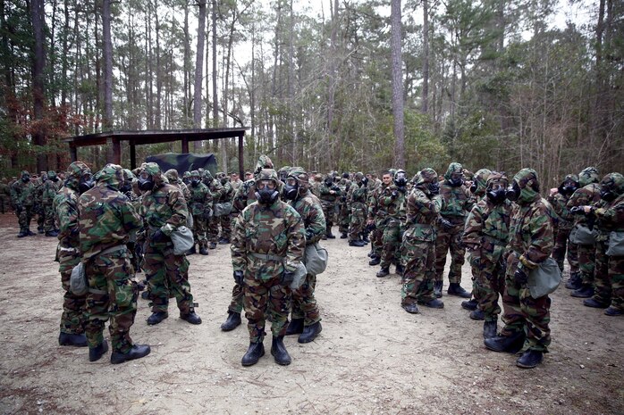 Marines from Marine Wing Support Squadron (MWSS) 272 prepare to go into the gas chamber aboard Marine Corps Base Camp Geiger, Feb. 6. A group of special trained Marines will then set up a detailed troop decontamination line in order to decontaminate the Marines. (U.S. Marine Corps photo by Lance Cpl. Andy J. Orozco/Released)