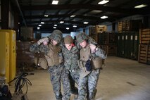 Marines from Marine Wing Support Squadron (MWSS) 272 participate in a Disaster Assistance Response Team (DART) training event at the squadron’s supply building aboard Marine Corps Air Station New River, Feb. 9. The training event was part of their field exercise (FEX) Feb. 5-9.(U.S. Marine Corps photo by Lance Cpl. Andy J. Orozco/Released)
