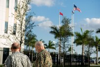 Commander of U.S. Southern Command Gen. John F. Kelly speaks with Chairman of the Joint Chiefs of Staff Gen. Martin E. Dempsey during a visit to U.S. Southern Command headquarters at U.S. Army Garrison-Miami Feb. 10, 2014. (DoD photo by Mass Communication Specialist 1st Class Daniel Hinton)