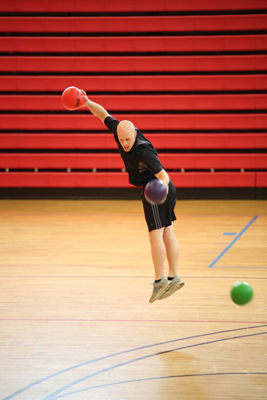 A Marine dodges a ball at Barber Physical Activity Center on Feb. 7, 2014. He was participating in the finals of the Headquarters and Service Battalion Quarterly Dodge Ball Tournament.