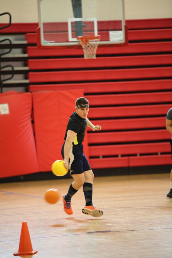 A Marine dodges a ball at Barber Physical Activity Center on Feb. 7, 2014. He was participating in the Headquarters and Service Battalion Quarterly Dodge Ball Tournament.