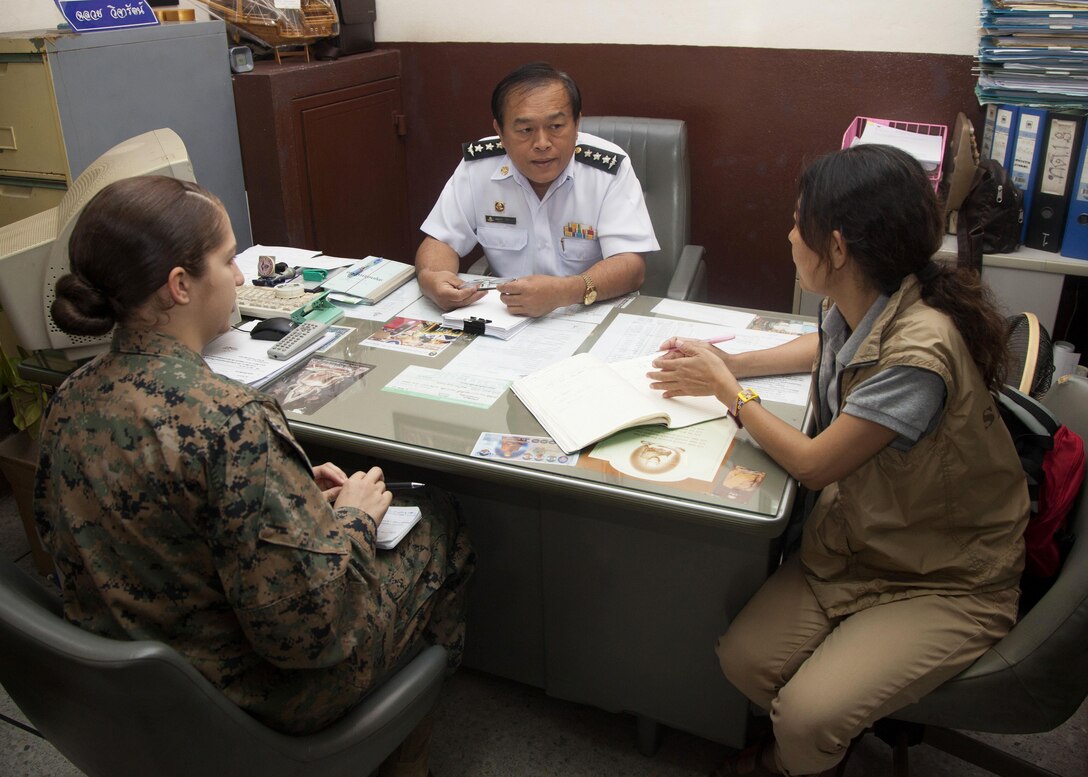 U.S. Marine Lance Cpl. Kylie Curtis with Civil Affairs Attachment, G3 Operations, III Marine Expeditionary Force speaks to Chaluay Wijarat, Station Master of the Phitsanulok train station. The Marines visited the Phitsanulok train station and bus terminal to determine their capabilities in Phitsanulok, Kingdom of Thailand, on Feb. 06, 2014 during exercise Cobra Gold 2014 (CG 14). CG 14, in its 33rd iteration, demonstrates the U.S. and the Kingdom of Thailand's commitment to our long-standing alliance and regional partnership, prosperity and security in the Asia-Pacific region. (U.S. Marine Corps photo by Lance Cpl. Leah Agler/ Released) 