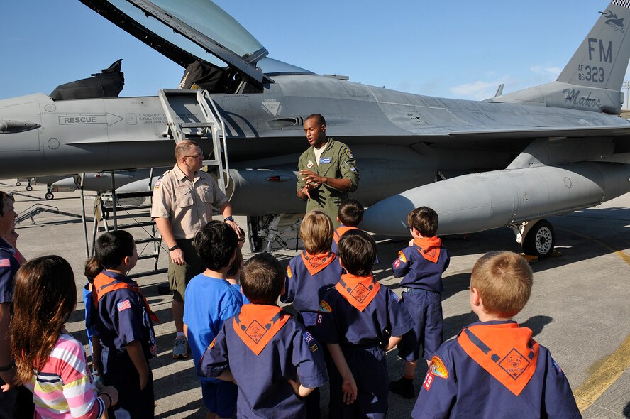 First lieutenant Chris Harrison, F-16 pilot with the 93rd Fighter Squadron, Homestead Air Reserve Base, Fla., talks to Tiger Cub Scouts from Pack 69, Homestead, Fla., on Jan. 29.  The kids were treated to a three hour tour of the base stopping at the 93rd FS; U.S. Coast Guard Maritime Safety and Security Team and the U.S. parachute team: The Golden Knights. The Tiger Cub Scout program is for boys who have completed Kindergarten (or are age 7). (U.S. Air Force photo/Tim Norton)
