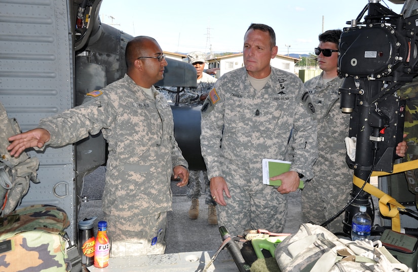 U.S. Army Command Sgt. Maj. William B. Zaiser, U.S. Southern Command Senior Enlisted Advisor, spent the day at Soto Cano Air Base, Feb. 11, 2014. Zaiser received a mission briefing from U.S. Army Col. Thomas Boccardi, Joint Task Force-Bravo Commander, as well as a base tour from U.S. Army Command Sgt. Maj. Norriel Fahie, Army Support Activity. Following a lunch with enlisted members of the Task Force, Zaiser spent the afternoon meeting with senior enlisted leaders and members of Joint Task Force-Bravo's Army Forces Battalion, Joint Security Forces, 1-228th Aviation Regiment, and 612th Air Base Squadron.  (U.S. Air Force photo by Capt. Zach Anderson)