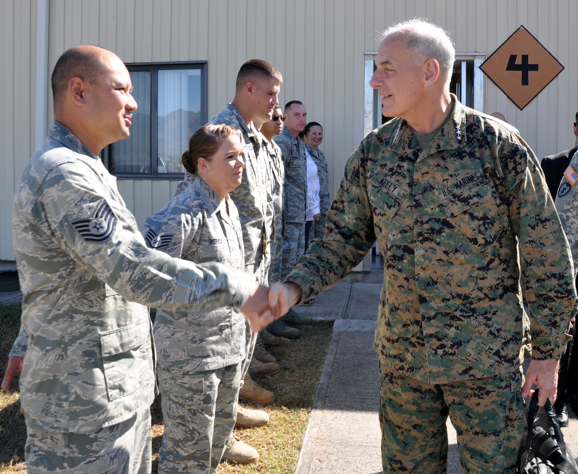 U.S. Marine Corps Gen. John F. Kelly, Commander, U.S. Southern Command, is greeted on the flightline by members of Joint Task Force-Bravo upon his arrival at Soto Cano Air Base, Honduras, Feb. 11, 2014. Kelly is visiting Honduras during the week to meet with U.S. and Honduran military and civilian leaders. (U.S. Air Force photo by Capt. Zach Anderson)