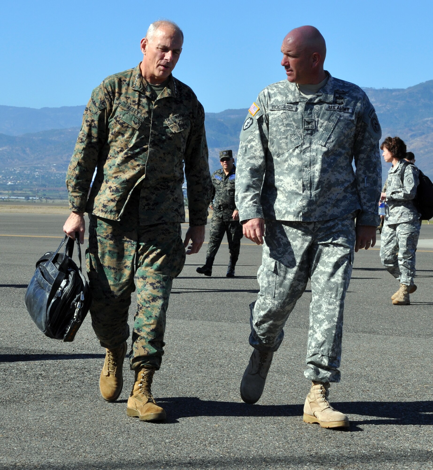 U.S. Army Col. Thomas Boccardi, Joint Task Force-Bravo Commander, greets U.S. Marine Corps Gen. John F. Kelly, Commander, U.S. Southern Command, on the flightline at Soto Cano Air Base, Honduras, Feb. 11, 2014. Kelly is visiting Honduras during the week to meet with U.S. and Honduran military and civilian leaders within the country. (U.S. Air Force photo by Capt. Zach Anderson)