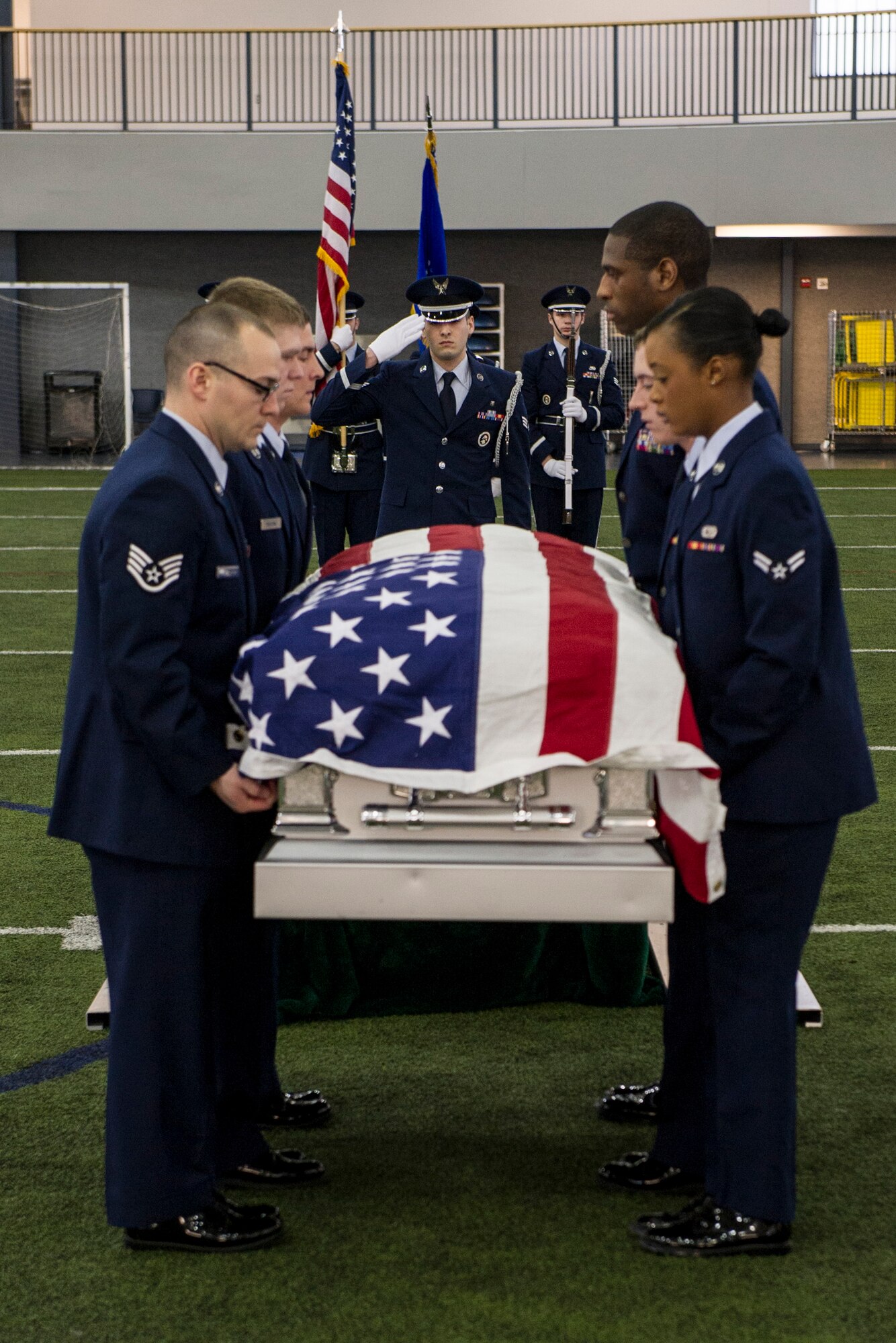 Members of the base honor guard team carry a casket during a mock military funeral with honors Feb. 7, 2014, Eielson Air Force Base, Alaska. Twelve new members completed 40 hours of training which included pall bearing, firing team, colors, proper wear of the ceremonial dress and the importance of military customs and courtesies. (U.S. Air Force photo by Senior Airman Joshua Turner/Released)